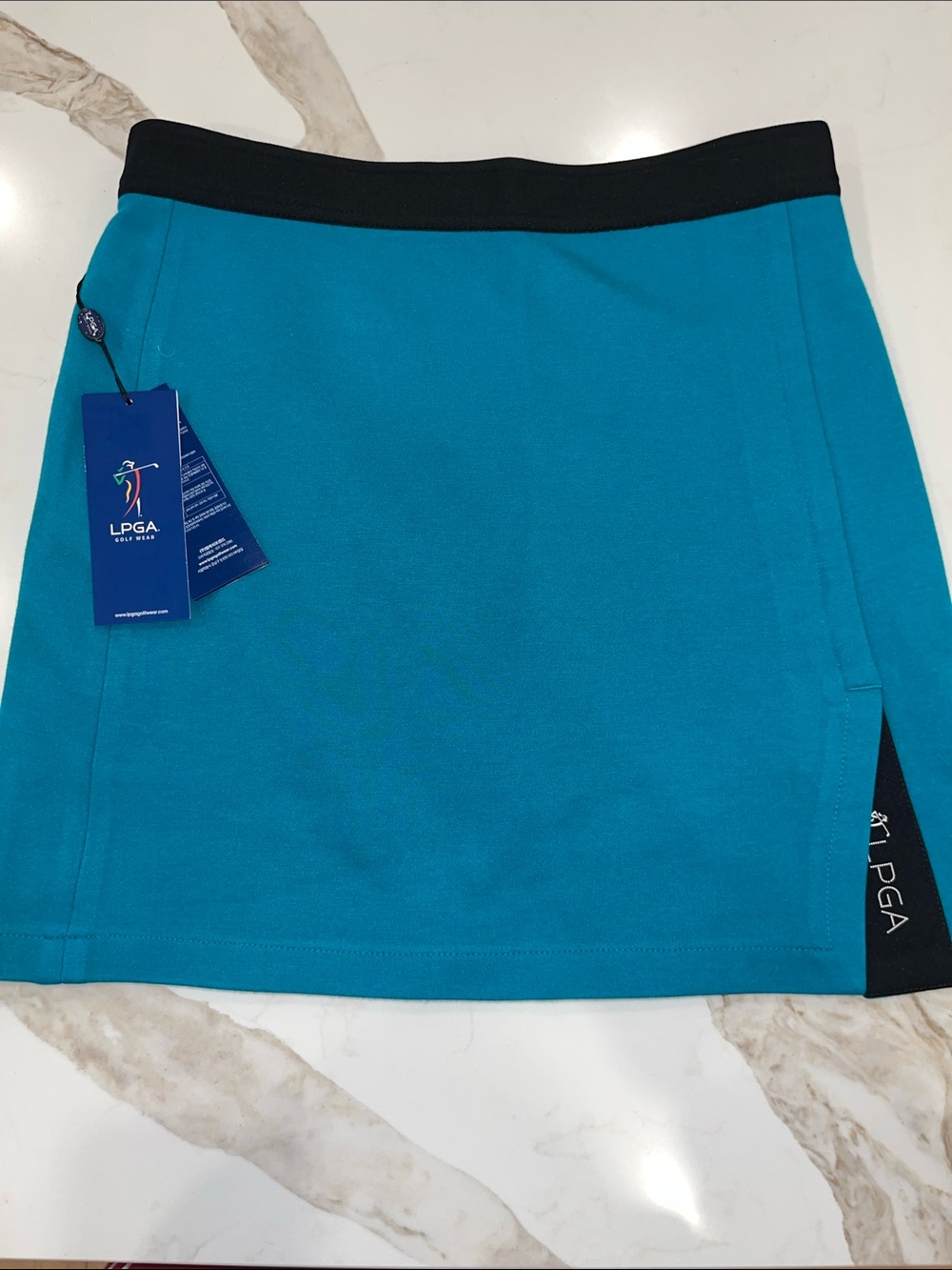 NWT LPGA Teal Blue Pull On Golf Skort with black waistband and inset LPGA logo
